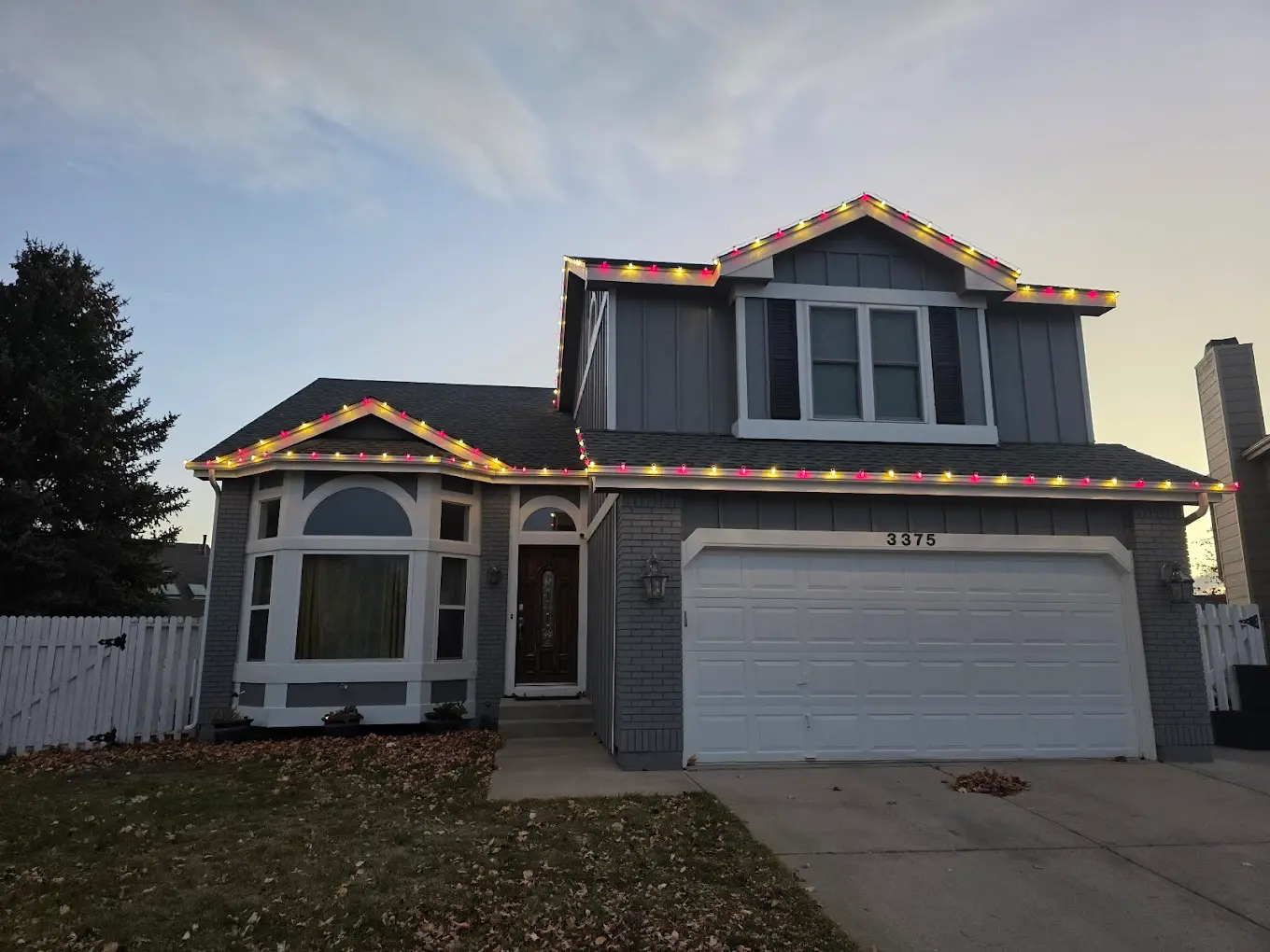 Front Range portfolio: multicolor C9 bulbs along a two-story roofline